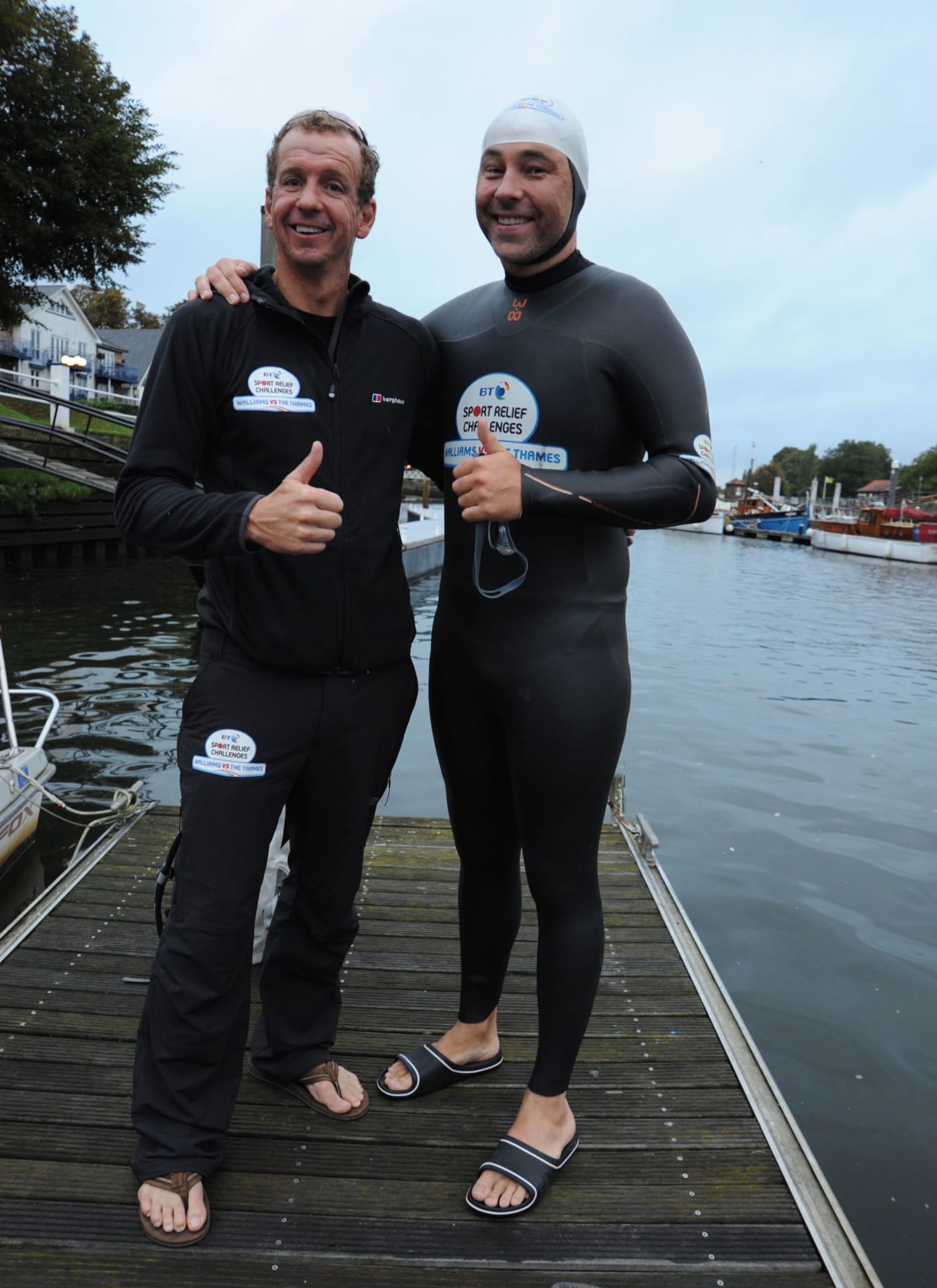 Greg Whyte and David Walliams standing on a jetty